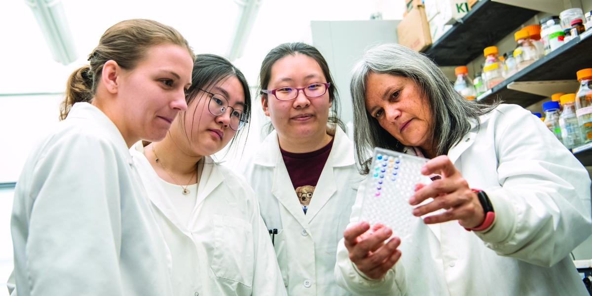 Women researchers staring at data