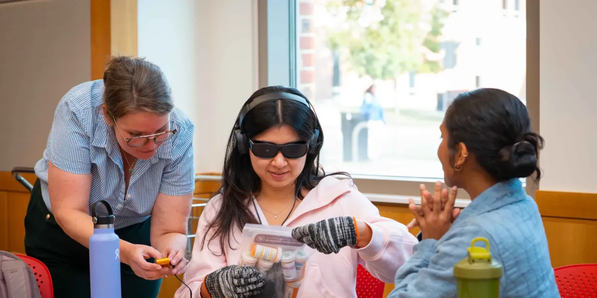 Students participating in a dementia simulation