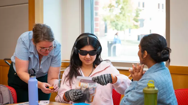 Students participating in a dementia simulation