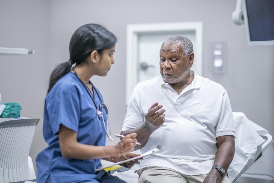 Doctor talking with a patient